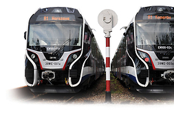 dwa nowoczesne pociągi WKD. Jeden jedzie w kierunku Komorowa, drugi - Warszawy